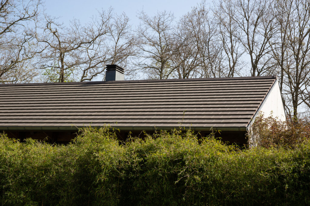 Flat roof tile house. Architecture detail